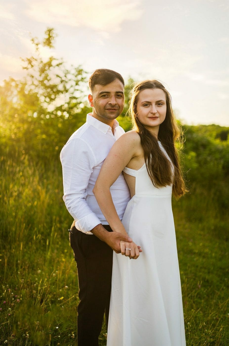 A photograph of a newly engaged couple in the sunset, taken by Somerset Photographer Victoria Welton