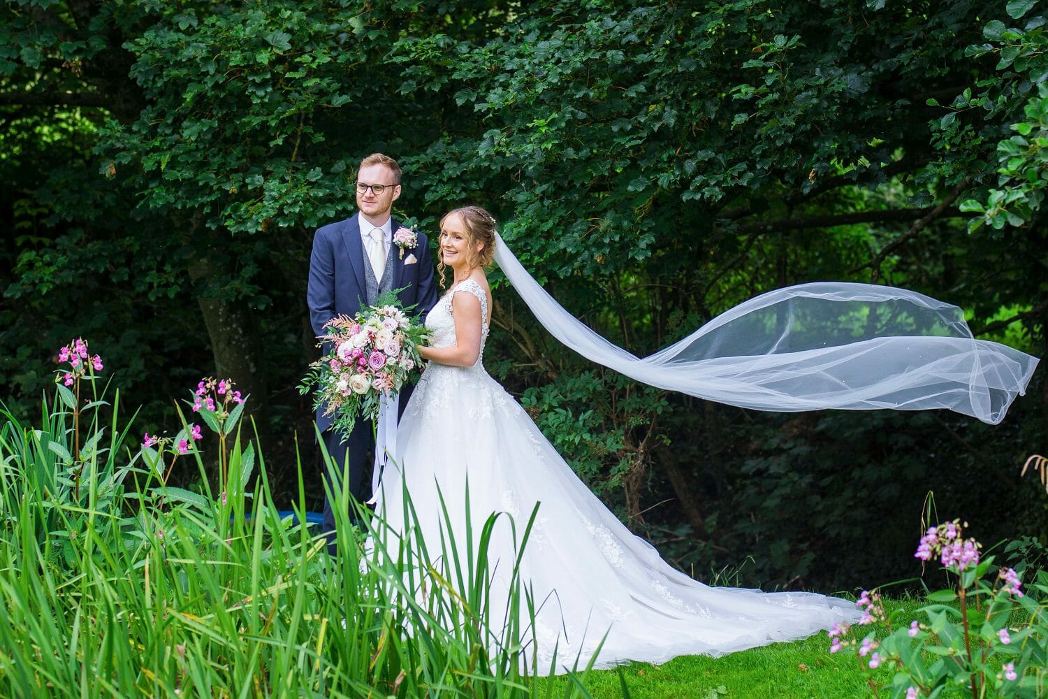 A beautiful floating wedding veil at Haselbury Mill Crewkerne, taken by Victoria Welton Photography